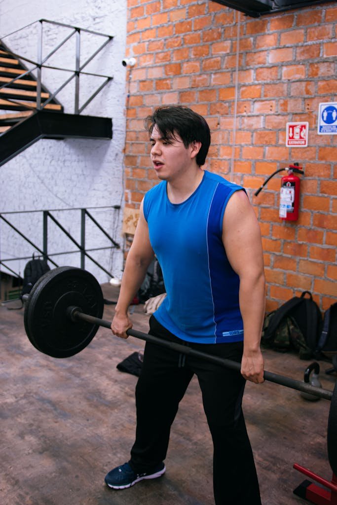 Man Deadlifting at a Gym