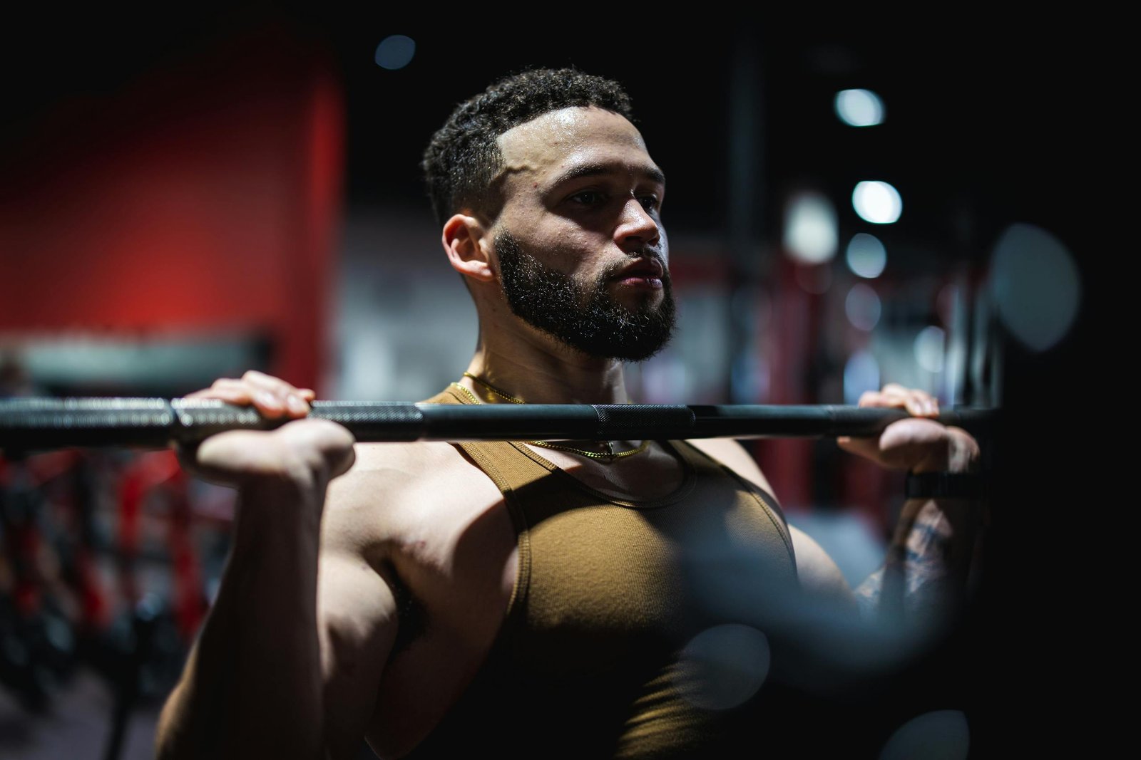 Muscular Man Lifting a Barbell