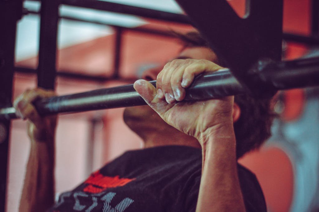 Man In Black Crew-neck Shirt Doing Pull-ups