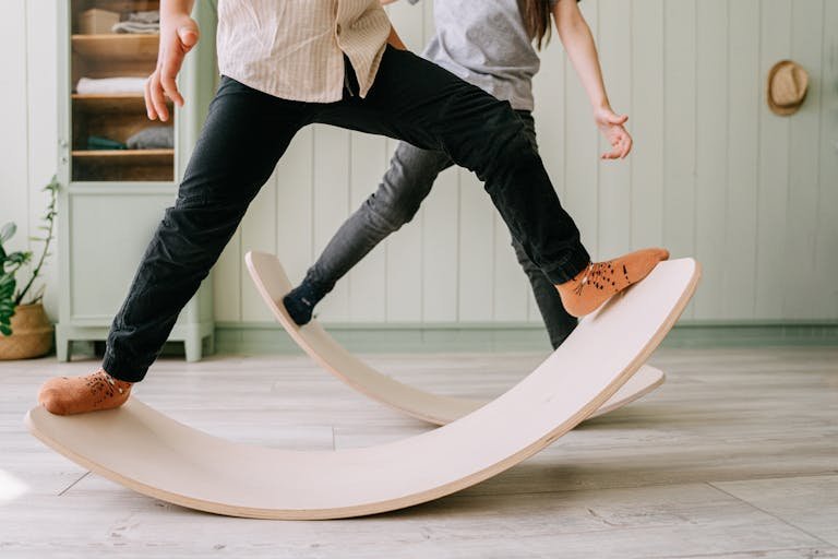 Kid Standing on a Balance Boards