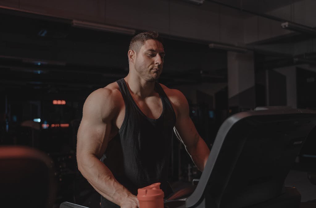 Man in Black Tank Top Exercising