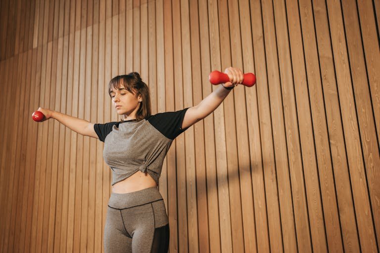 Woman Lifting Two Dumbbells